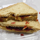 peanut butter and jelly sandwich in plastic clamshell packaging